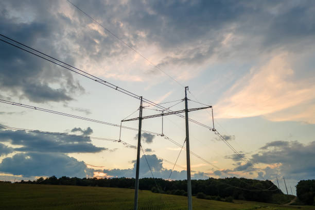 istock High voltage tower with electric power lines at sunset. 1361764411