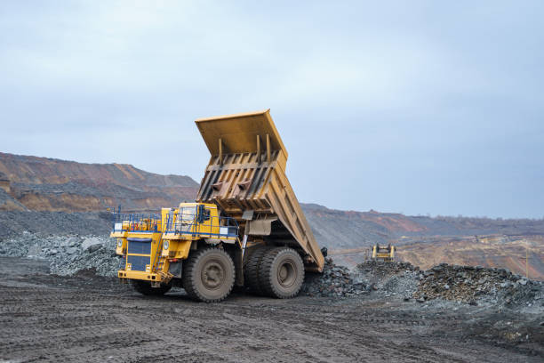istock A large yellow dump truck unloads minerals. 1361770710
