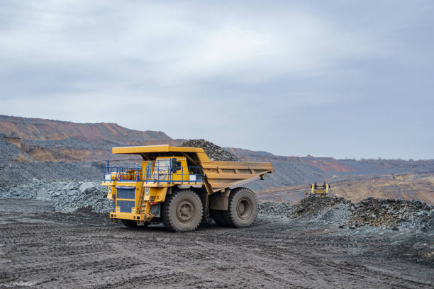 istock A large yellow dump truck unloads minerals. 1361770713