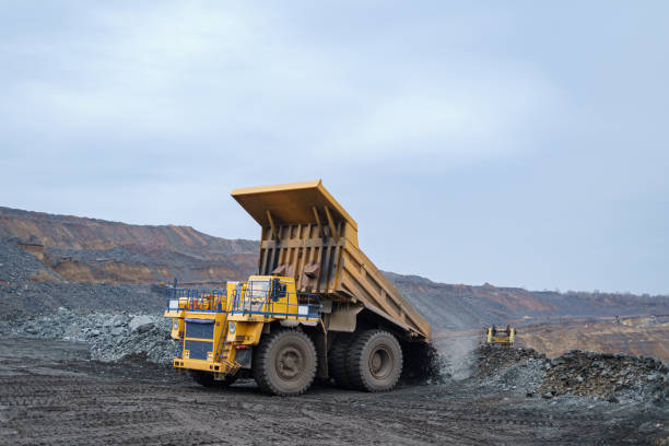 istock A large yellow dump truck unloads minerals. 1361770826