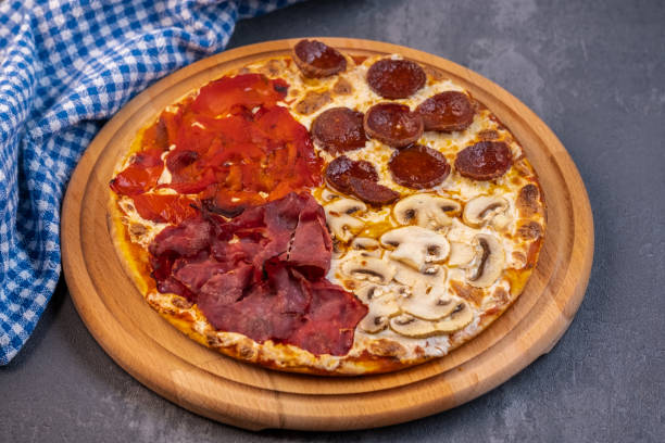 istock Pizza with four different type of ingredients 1361772062