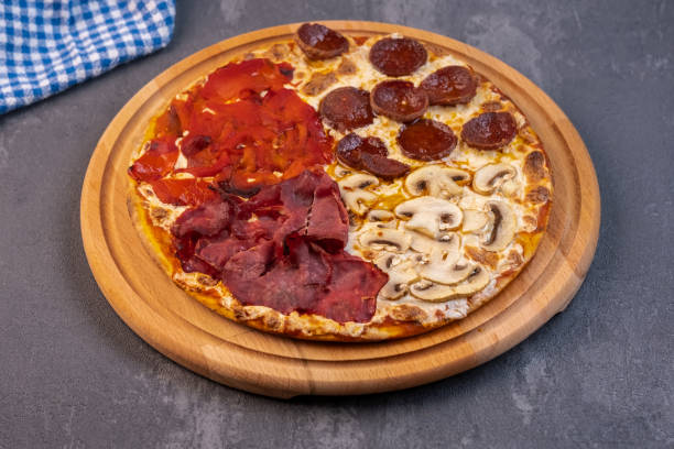 istock Pizza with four different type of ingredients 1361772392