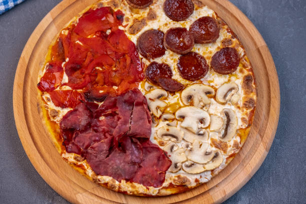 istock Pizza with four different type of ingredients 1361773250