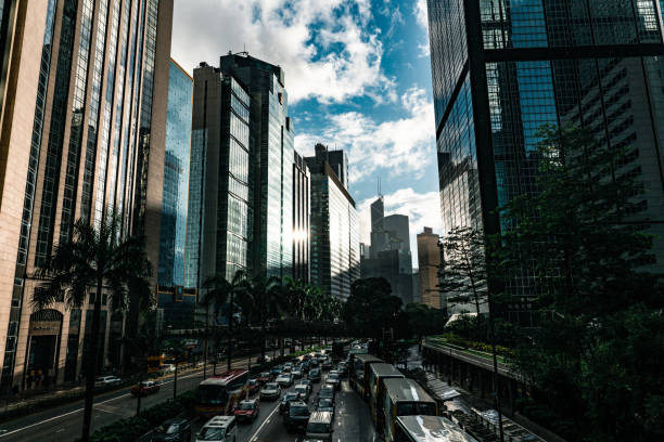Hong Kong traffic zooming through skyscraper avenue