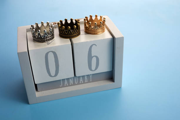 Epiphany Day Concept. 6 January calendar with three crowns on bue background Epiphany Day Concept. 6 January calendar with three crowns on bue background. religious celebration stock pictures, royalty-free photos & images