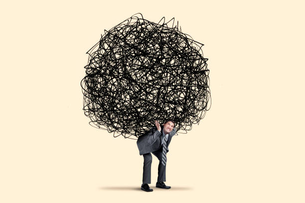 istock Man Carries Large Burden On His Shoulders 1361776987