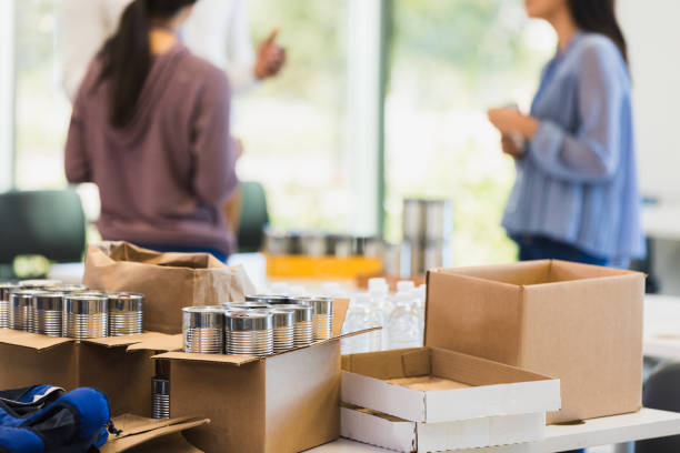 istock Table filled with donated items during charity drive 1361777347