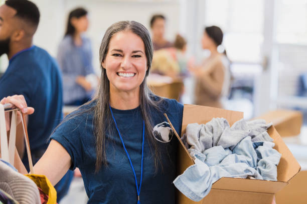 istock Thrift shop manager poses for photo 1361778252