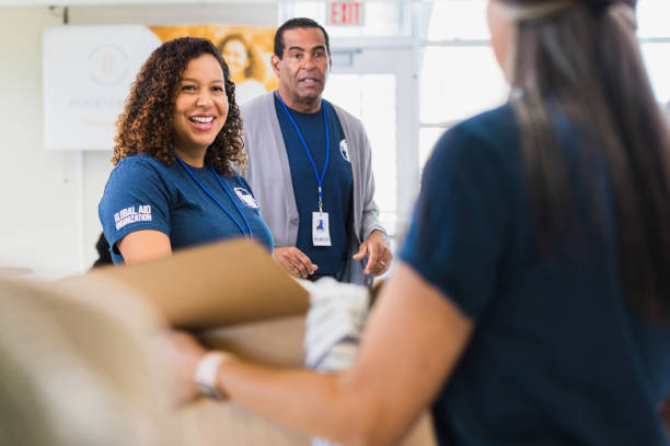 istock Diverse volunteers work together at thrift shop 1361778529