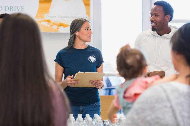 istock Couple consults each other during volunteer event 1361778763