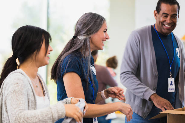 istock Volunteers enjoy working together 1361778786