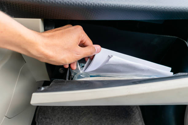 Dash board checking papers in the dashboard glove box stock pictures, royalty-free photos & images