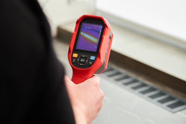 thermal imaging device for inspection of heating equipment. - infrared thermometer imagens e fotografias de stock