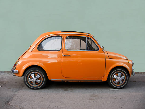 Fiat 500 orange. Old Italian classic car.  vintage car stock pictures, royalty-free photos & images
