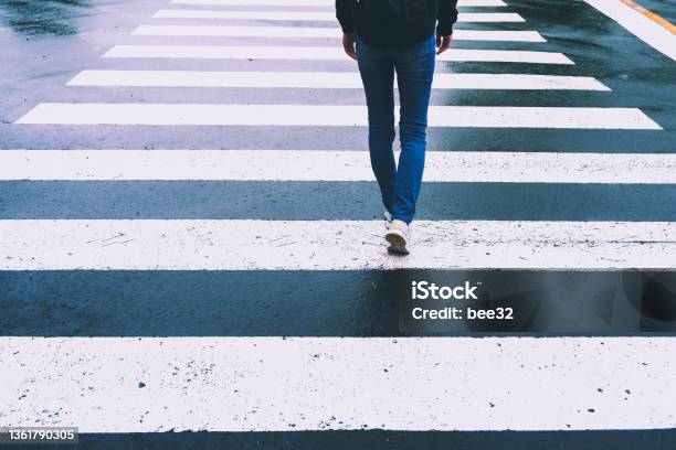 Photograph Of The Feet Of A Woman Walking On The Road Stock Photo - Download Image Now