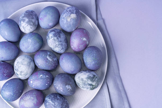 istock Part of plate with eggs painted for Easter on dining napkin. 1361790334