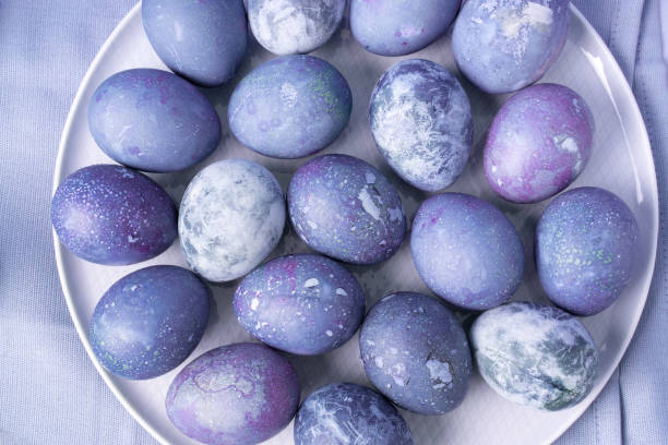 istock Part of plate with eggs painted for Easter on dining napkin. 1361790341