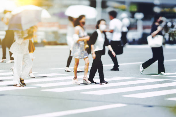 istock Many people crossing Osaka in Japan 1361793171