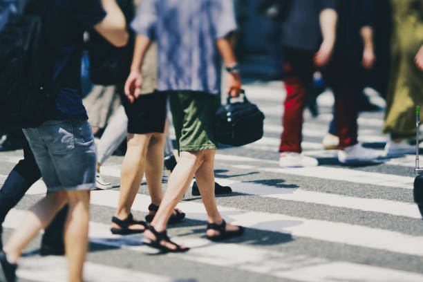 istock Many people crossing Osaka in Japan 1361793198