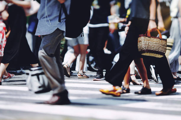 istock Many people crossing Osaka in Japan 1361793204