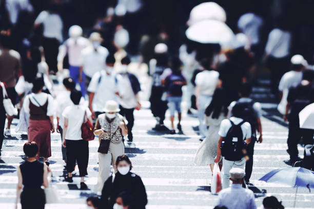 istock Many people crossing Osaka in Japan 1361793224