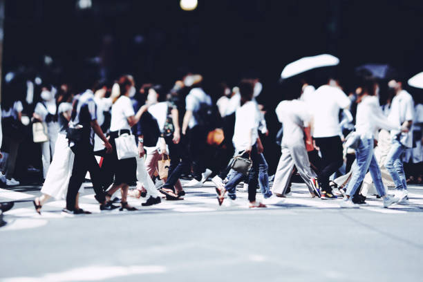 istock Many people crossing Osaka in Japan 1361793340