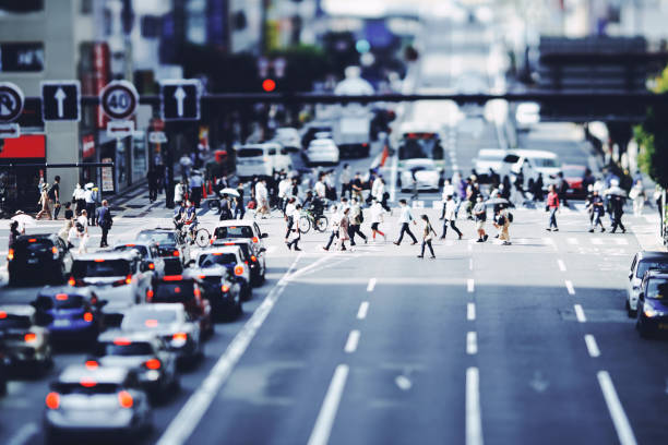 istock Many people walking in the downtown area 1361793381