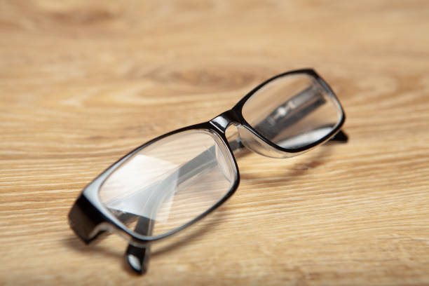 isolated glasses on wooden background