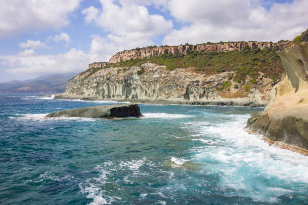 View of beautiful cliffs along the coast facing the Mediterranean sea, Sardinia, Italy.