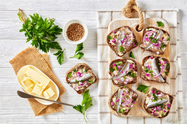 istock pickled sprat rye bread open sandwiches, top view 1361800483