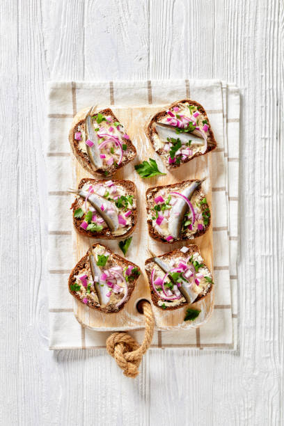 istock pickled sprat rye bread open sandwiches, top view 1361800485