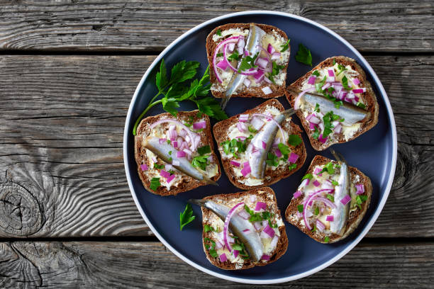 istock pickled sprat rye bread open sandwiches, top view 1361800493