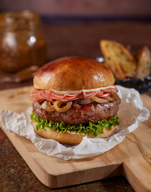 istock hamburger on wooden plate and paper 1361800667