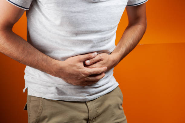 istock the man has a stomach ache 1361802360