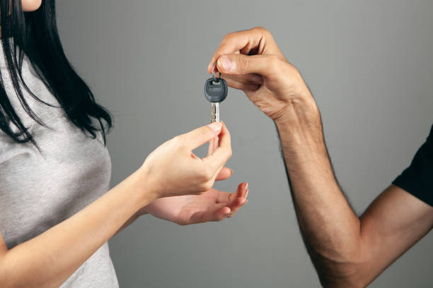 istock couple holding house keys 1361806425