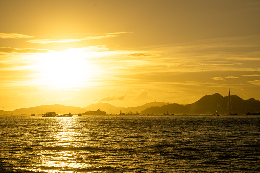 Sunset over the ocean. Scenic view of islands and hills during