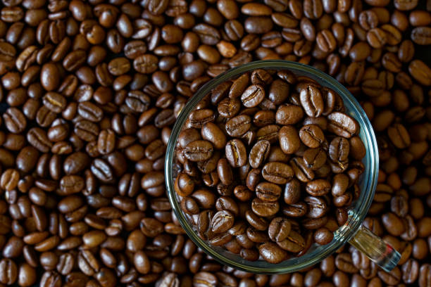 istock Transparent glass mug with roasted coffee beans 1361807578