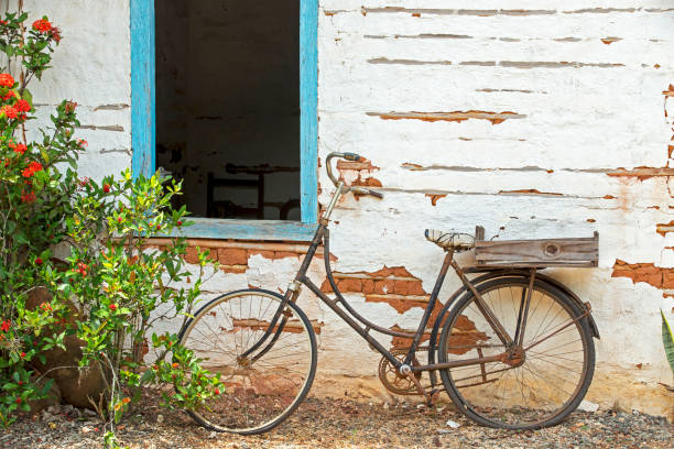 istock Old bicycle leaning against the wall 1361810790