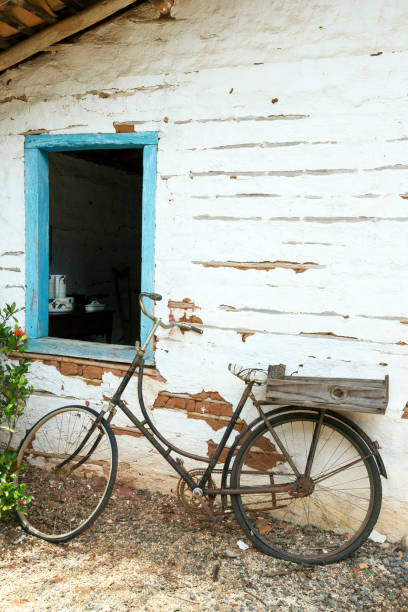 istock Old bicycle leaning against the wall 1361810799