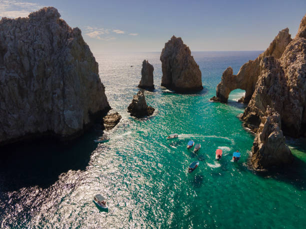 Aerial view looking down at the famous rock formations and Arch of Cabo San Lucas, Baja California Sur, Mexico Darwin Arch glass-bottom boats viewing sea life stock photo