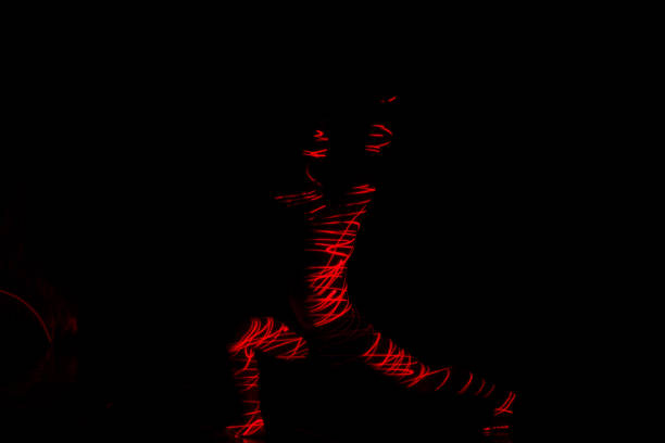 istock Ballet dancer dancing in front of and red light while expressing the hell with her magnificent dance moves. 1361815146
