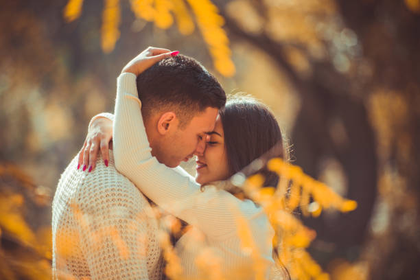 istock Modern couple looking at each other in the wood 1361815237