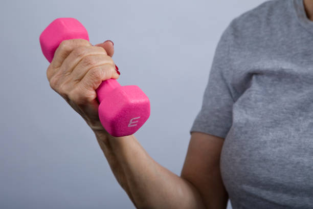 istock Senior woman curling 3 pound dumbbell 1361817301
