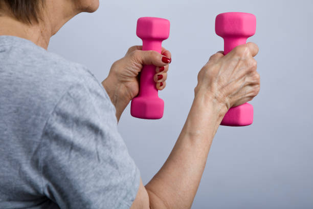 istock Senior woman exercising with 3 pound dumbbells 1361817305