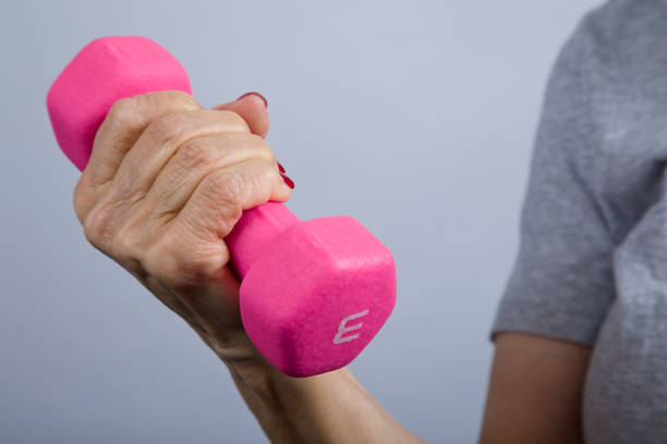 istock Senior woman lifting 3 pound dumbbell 1361817311