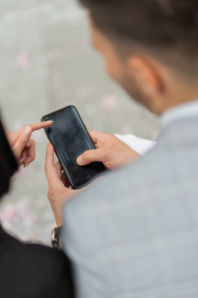 istock Checking their business phone 1361817361