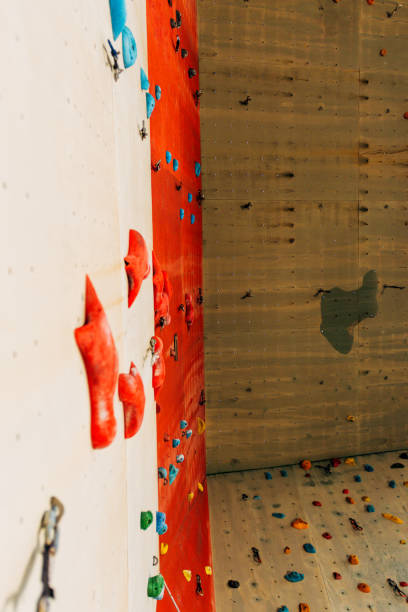 istock White climbing wall with colorful rocks 1361821389