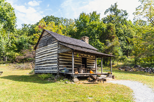 An old house in a farm on a sunny day in the Blue Ridge Mountains in Virginia.