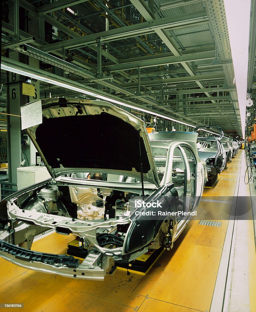 car production line car production line with unfinished cars in a row Automobile Industry Stock Photo