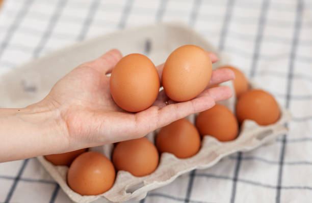 istock A few brown eggs among the empty cells of a large cardboard bag 1361832557